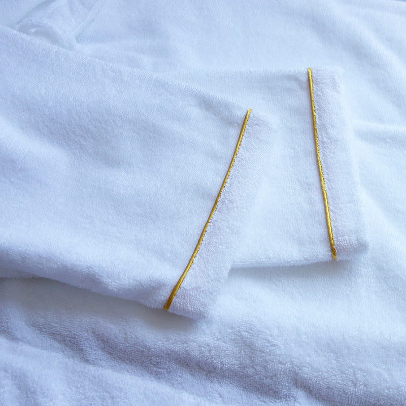 Close-up of bathrobe sleeve cuff with gold piping