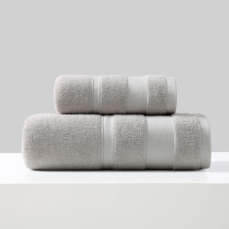 Rolled cotton bath towel and hand towel in light grey