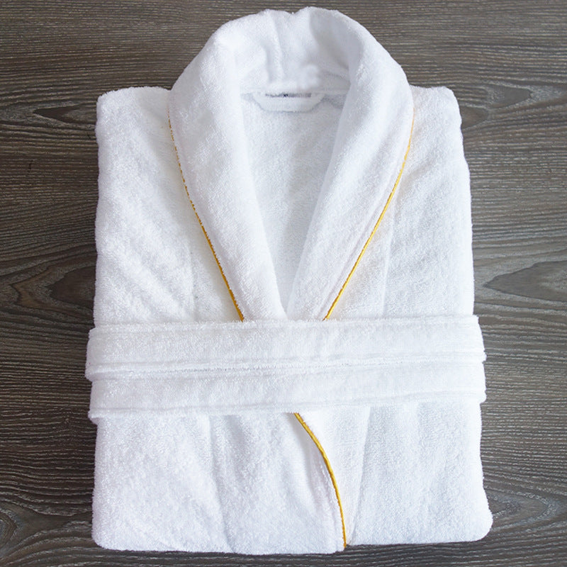 White cotton terry bathrobe folded flat with tie belt