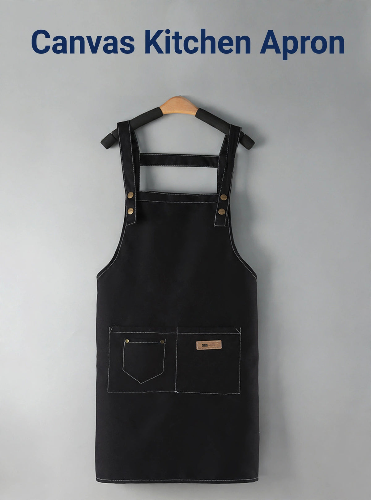 Black canvas kitchen apron on a hanger