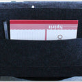 Dark grey felt bedside caddy holding a notebook and pen