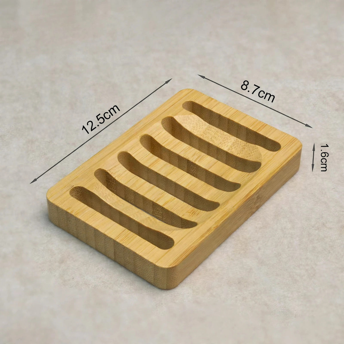 Bamboo soap dish with drainage slots, dimensions 12.5 x 8.7 x 1.6 cm